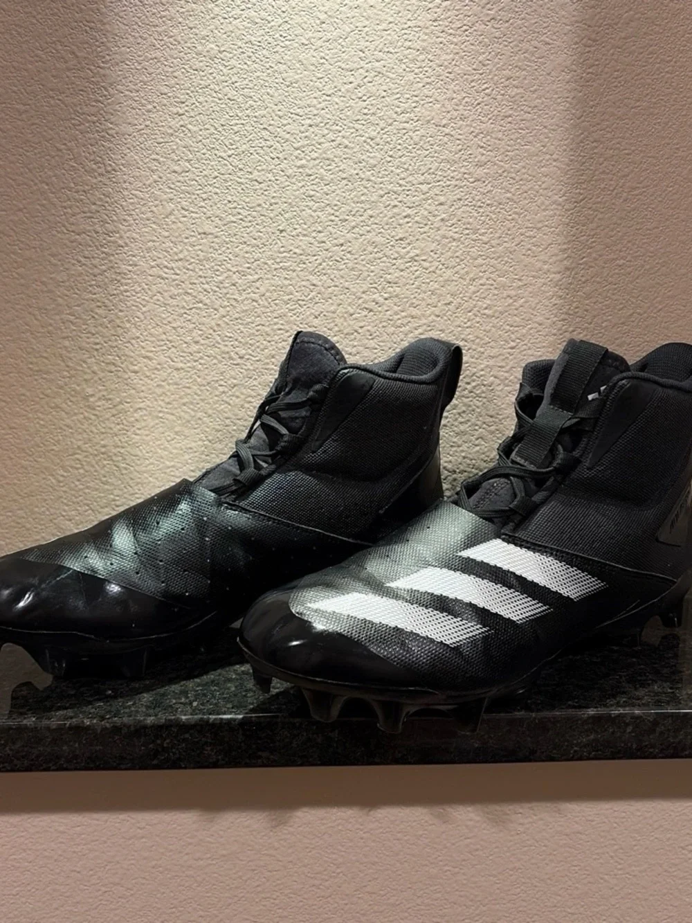 Black Mens Size 11 Football Cleats with White Stripes